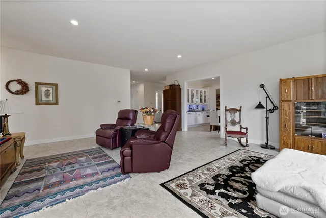 a living room with furniture rug and window