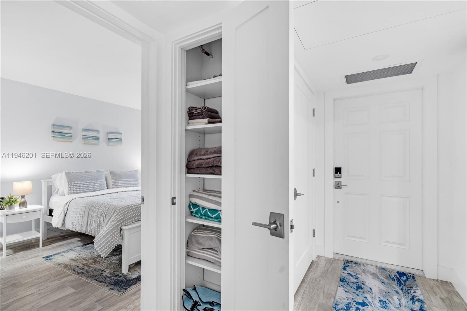 4502 North Federal Highway, Unit 167H Lighthouse Point, FL 33064 - Photo 19 of 31 a bedroom with furniture and a book shelf