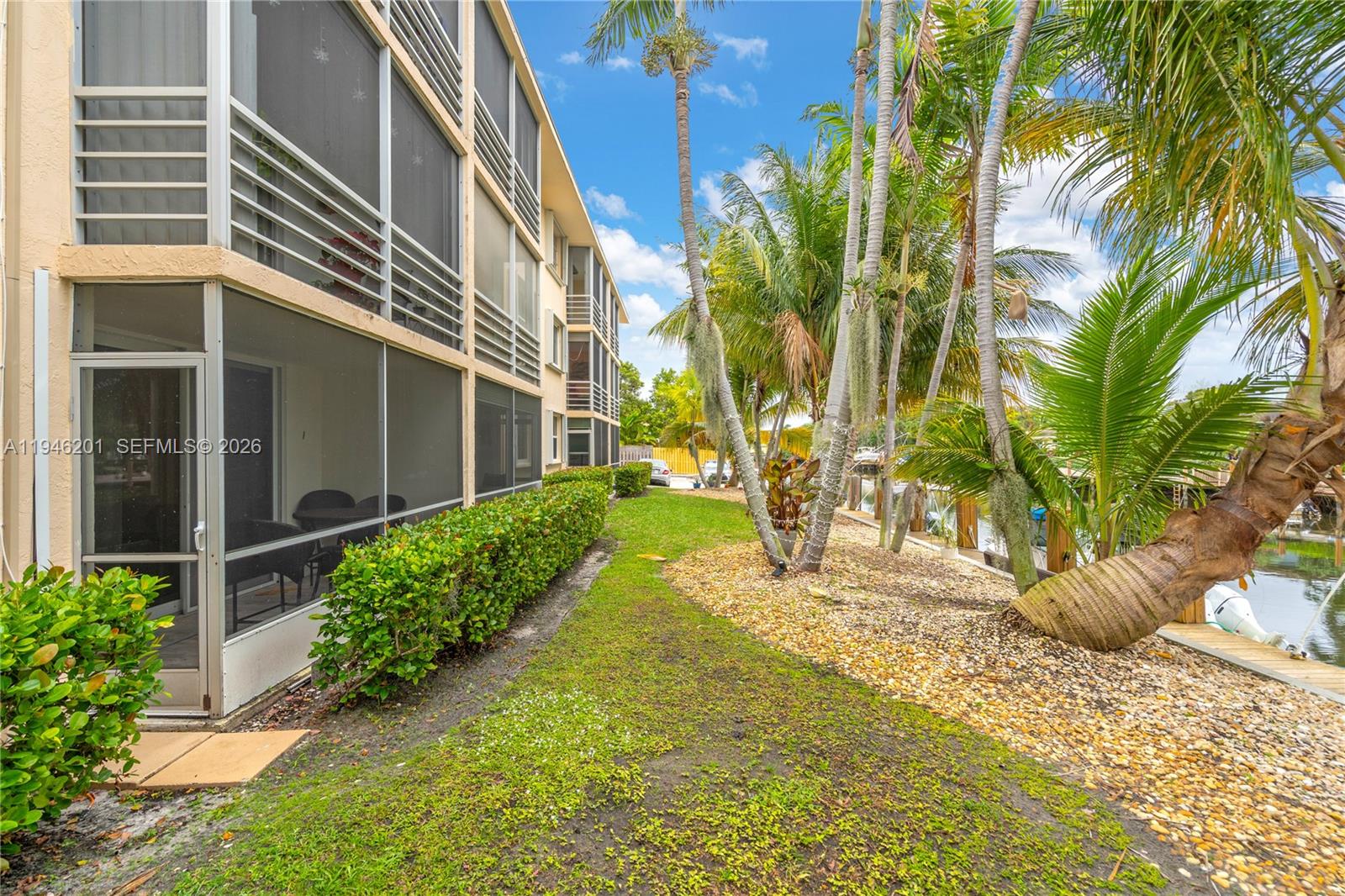 4502 North Federal Highway, Unit 167H Lighthouse Point, FL 33064 - Photo 2 of 31 a view of a yard along with potted plants