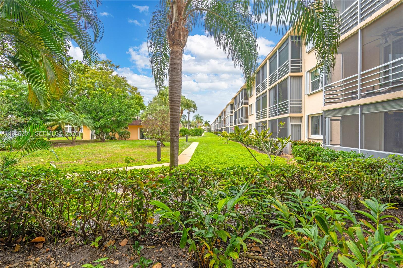 4502 North Federal Highway, Unit 167H Lighthouse Point, FL 33064 - Photo 21 of 31 a view of a garden with a building in the background