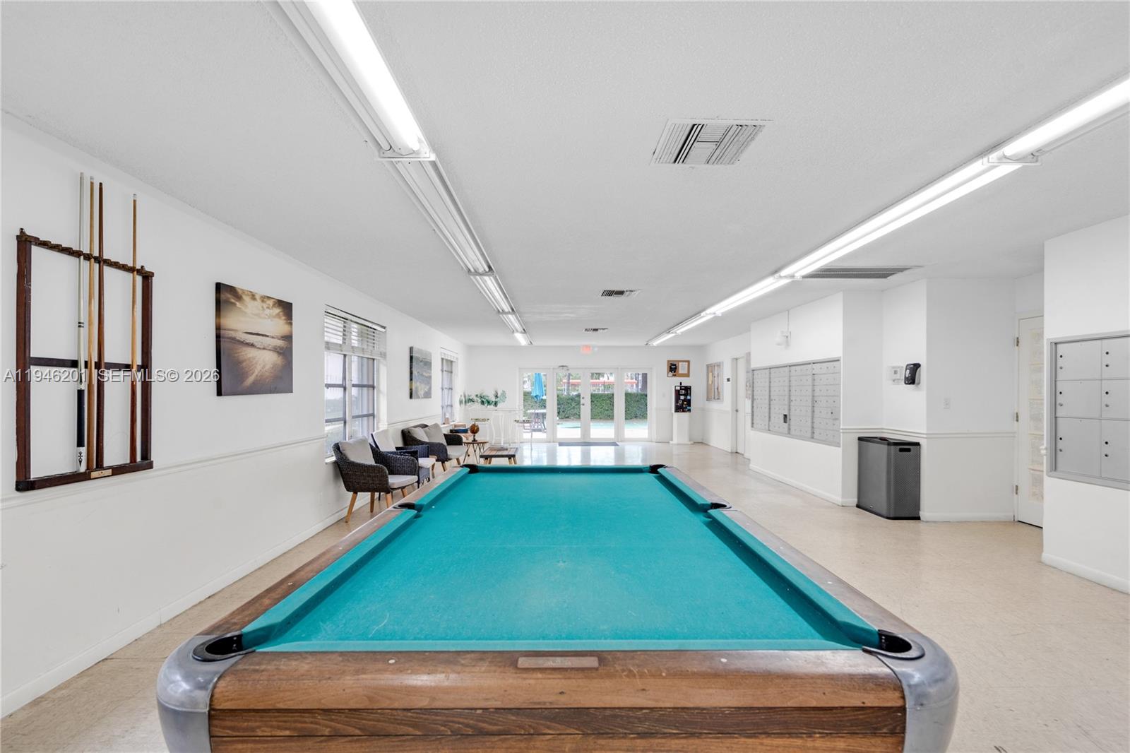 4502 North Federal Highway, Unit 167H Lighthouse Point, FL 33064 - Photo 25 of 31 a room with pool table and windows