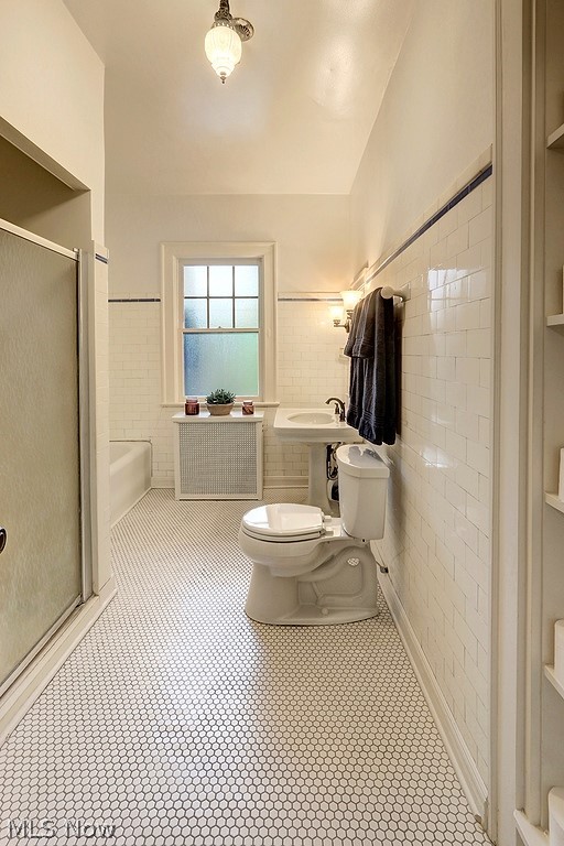 2115 Lamberton Road Cleveland, OH 44118 - Photo 15 of 29 The first floor bathroom exudes vintage charm, yet, feels modern, too!