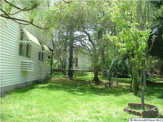 34 Sunset Road Manchester Township, NJ 08759 - Photo 3 of 3 a view of a backyard with a garden