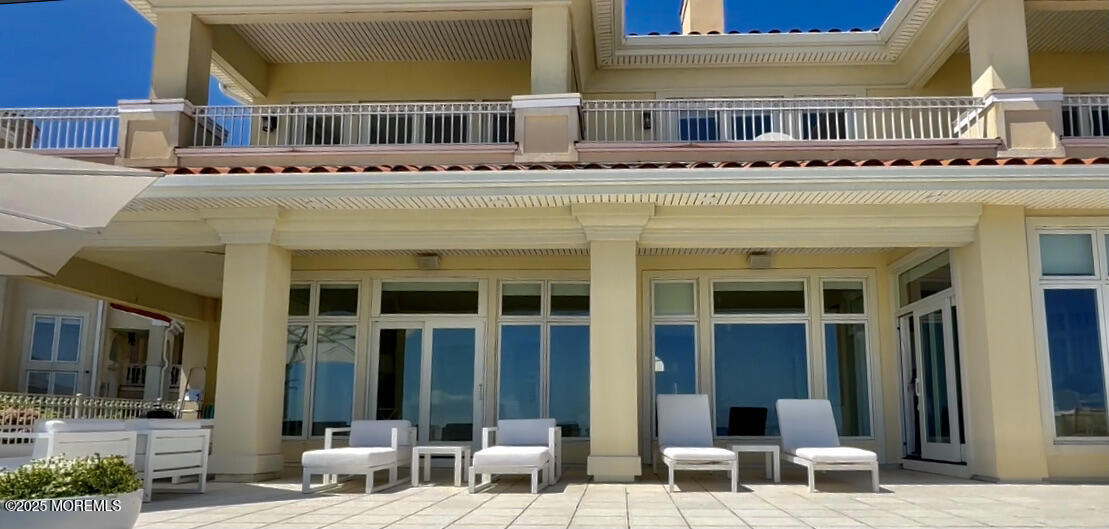 a view of a building with a sitting area