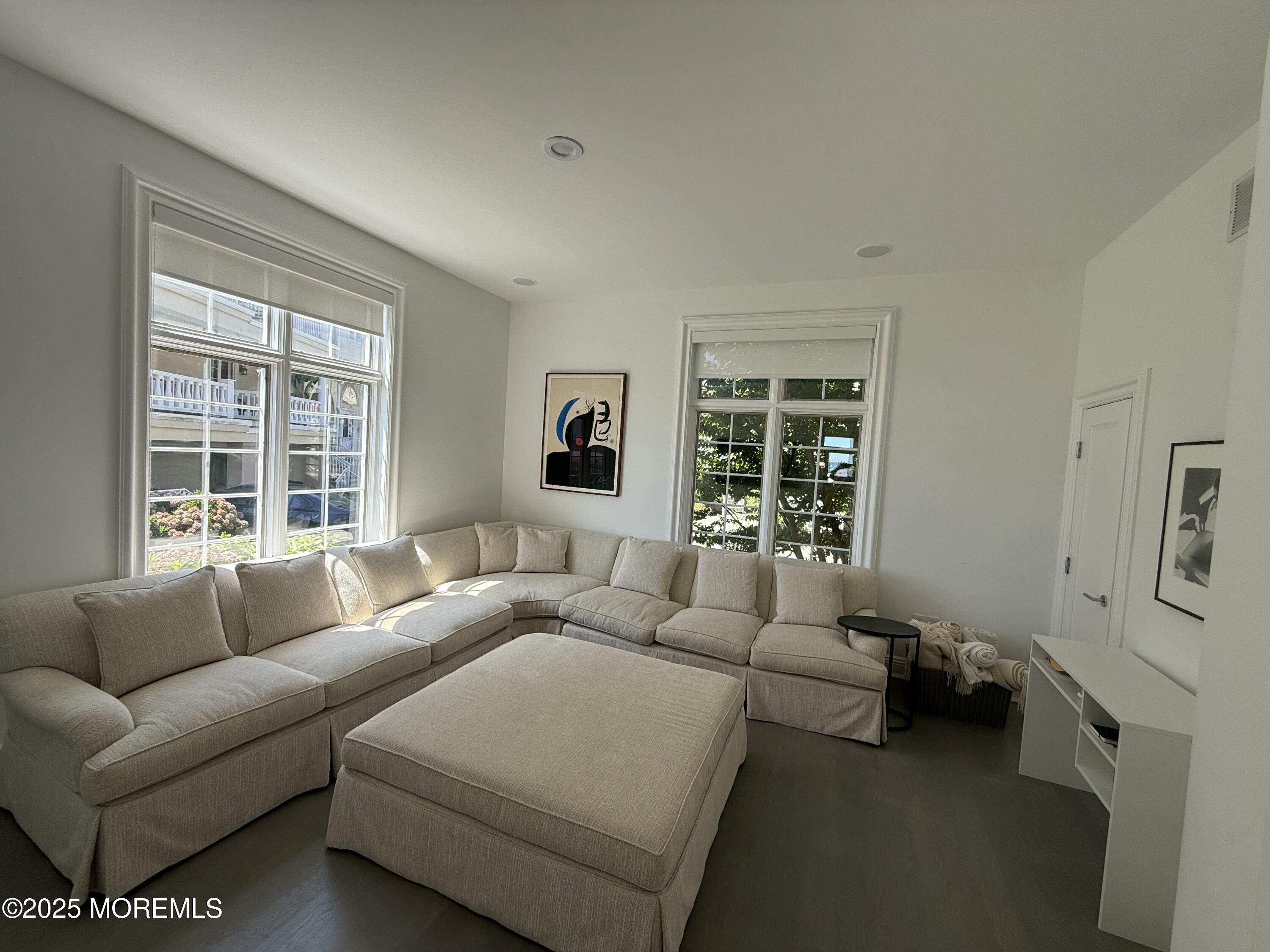 31 Riviera Drive Long Branch, NJ 07740 - Photo 12 of 12 a living room with furniture and a window
