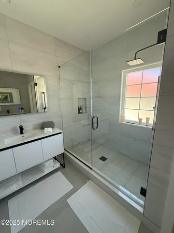 a bathroom with a tub and a shower