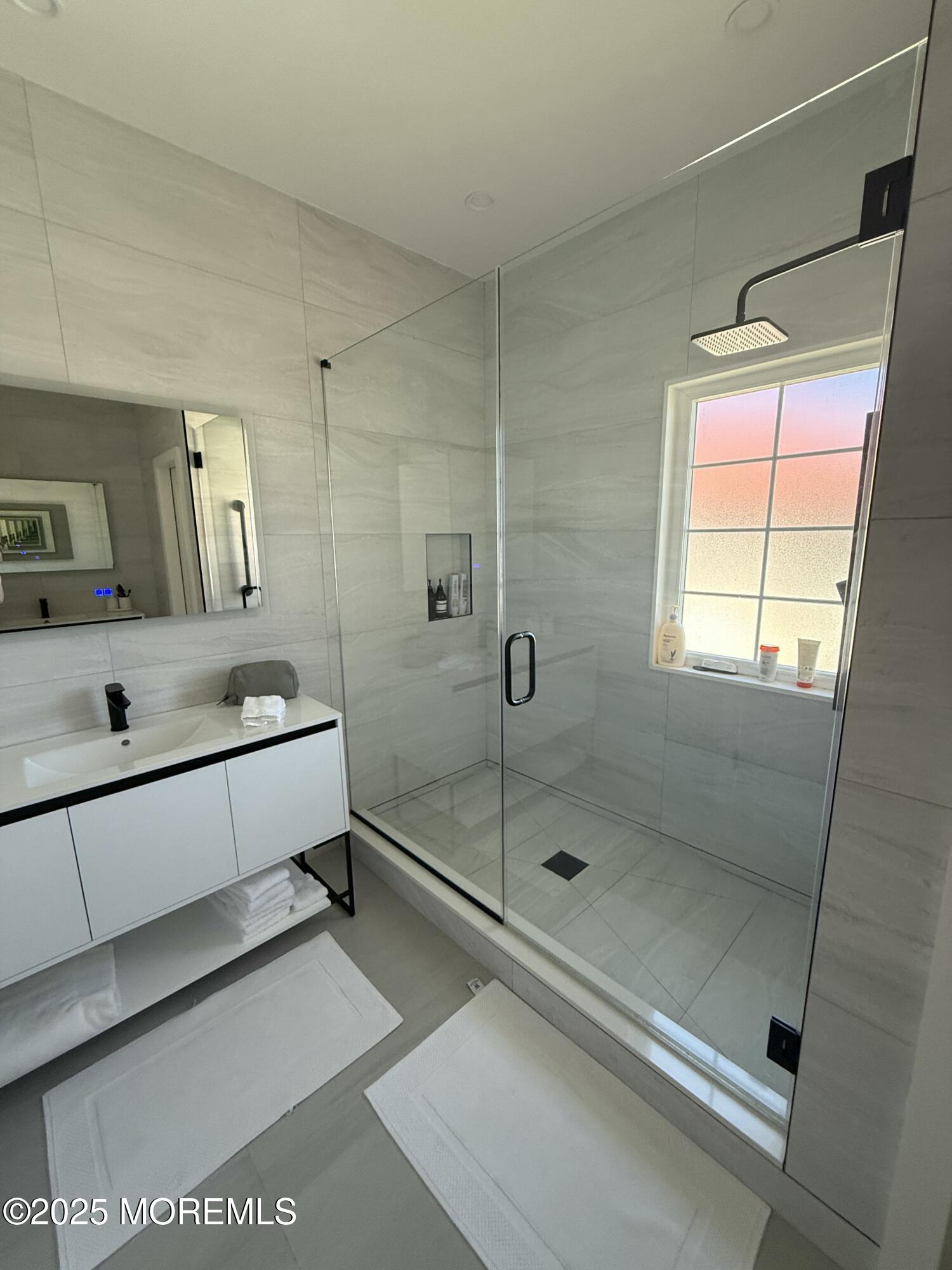 31 Riviera Drive Long Branch, NJ 07740 - Photo 10 of 12 a bathroom with a tub and a shower