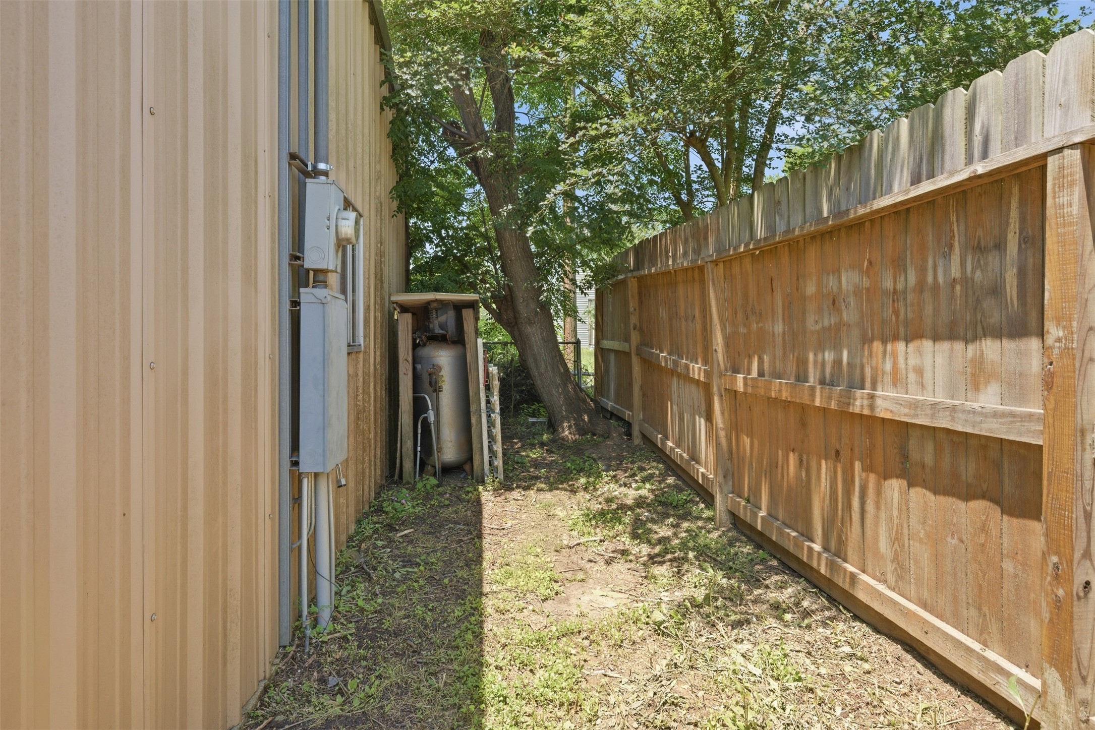 1310 Brazos Street Hempstead, TX 77445 - Photo 24 of 32 a view of a pathway of a barn with wooden fence
