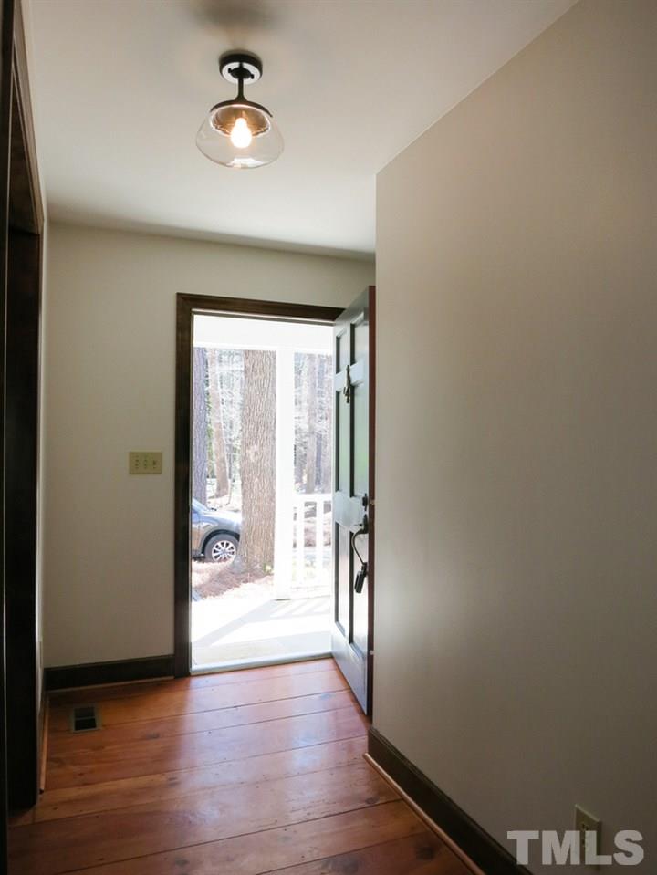 809 Ivanhoe Drive Raleigh, NC 27615 - Photo 3 of 30 Gorgeous wide plank pine floors in Foyer. NEW luxury vinyl plank flooring, neutral carpet & lighting throughout; Baths w/NEW granite counters, LVP flr, hardware & double rectangular sinks; fresh paint in & out! New Trane heat pump & ductwork 2011.