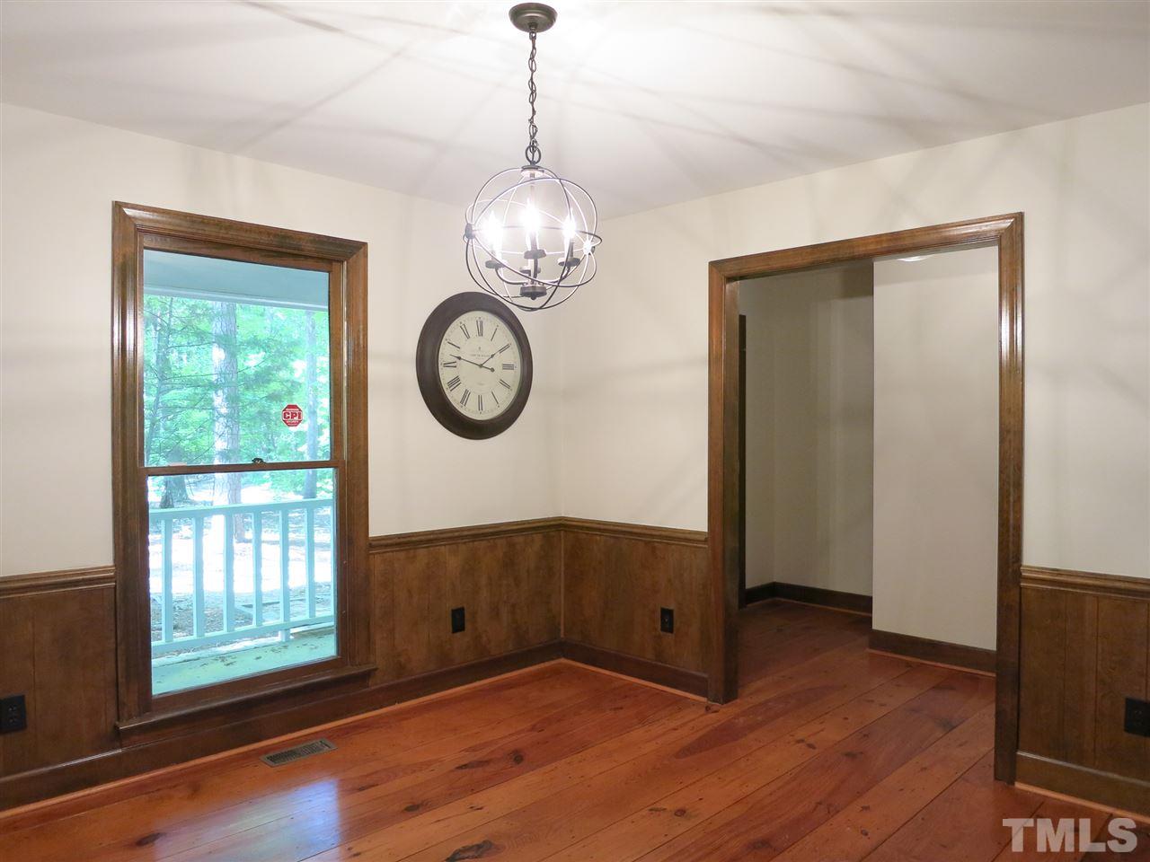 809 Ivanhoe Drive Raleigh, NC 27615 - Photo 10 of 30 Gorgeous wide plank pine floors in Dining Rm w/new light fixture.