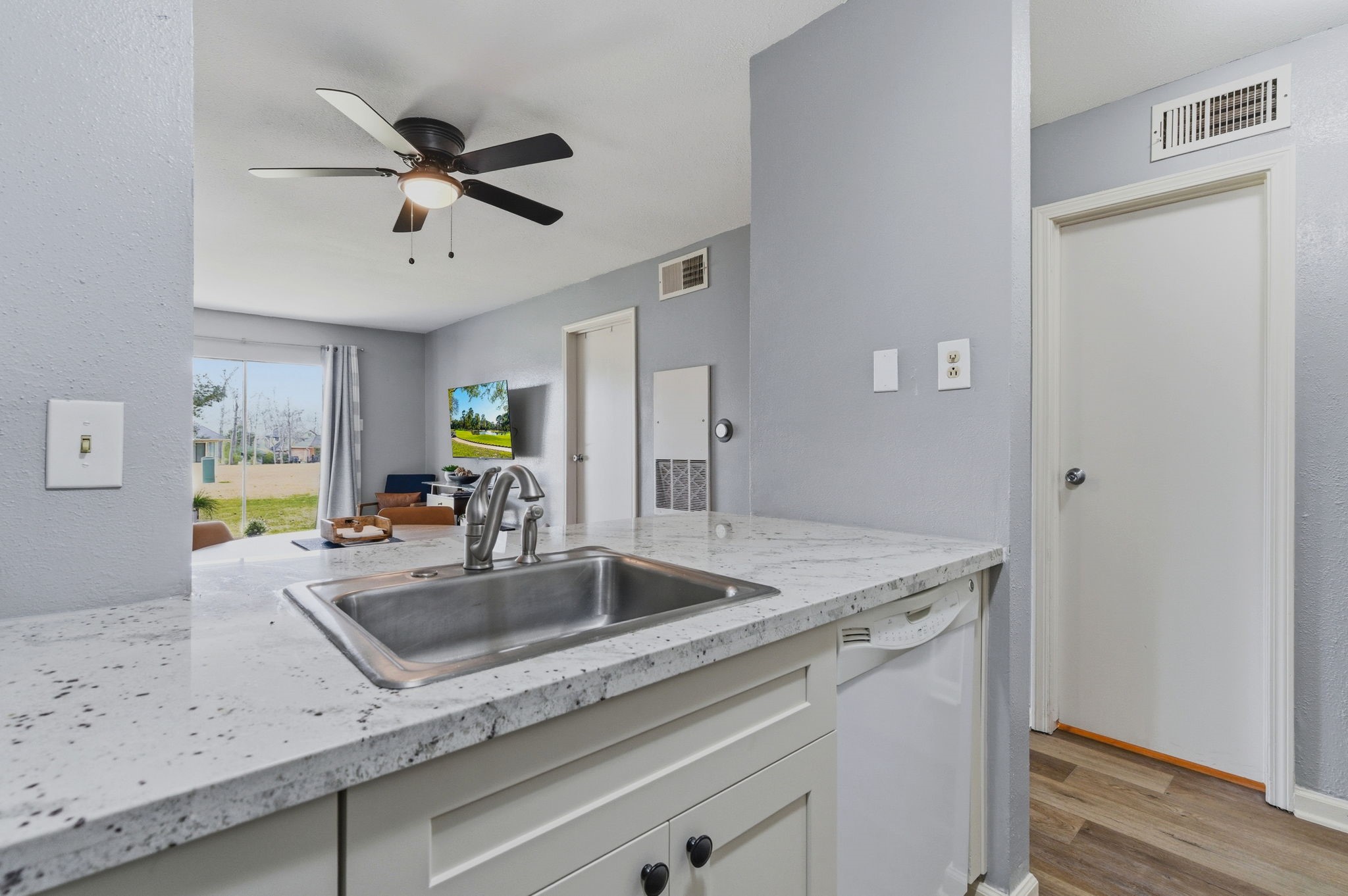 13151 Walden Road, Unit 127 Montgomery, TX 77356 - Photo 11 of 46 a kitchen with a sink a counter space and cabinets