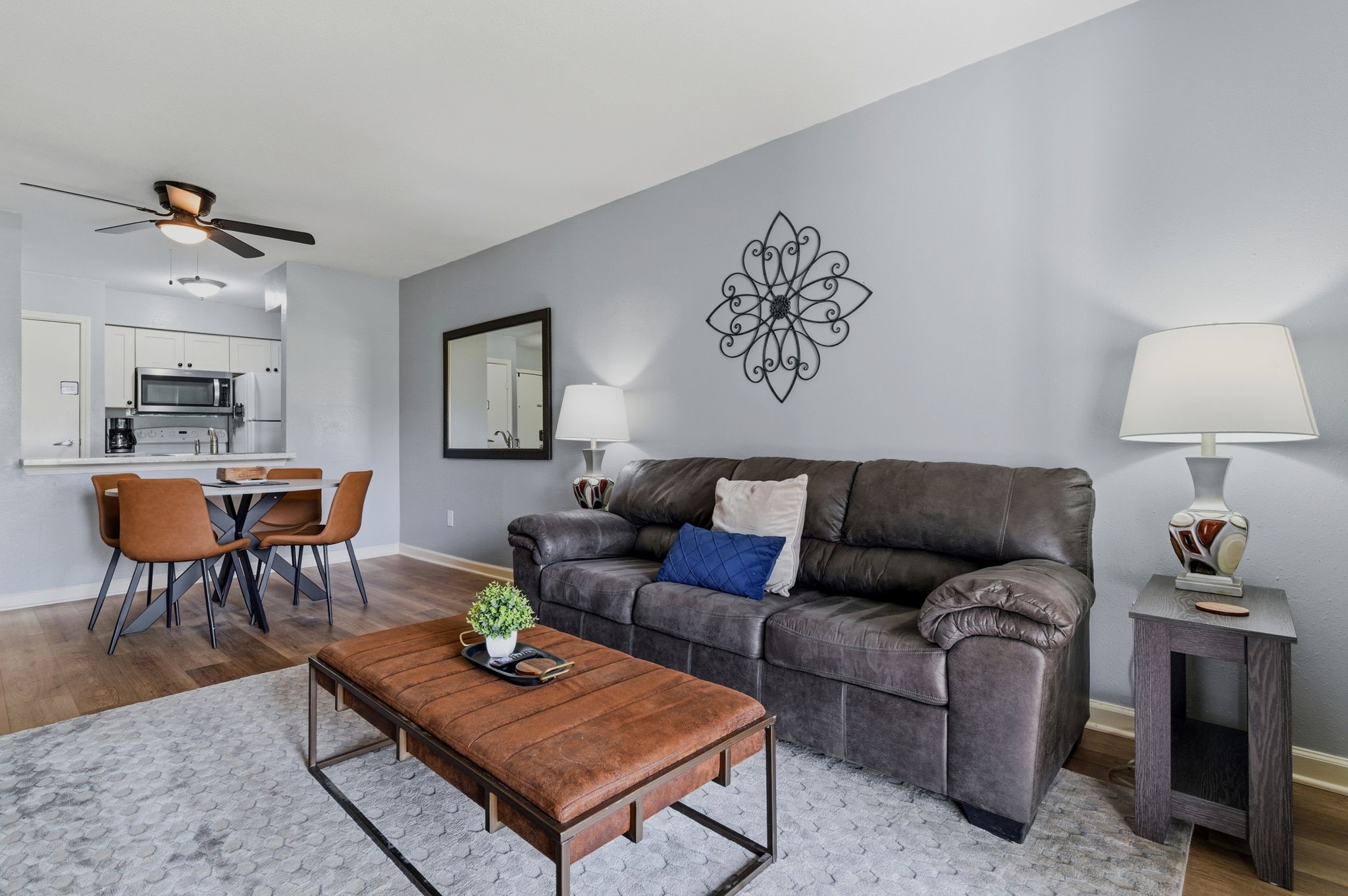 13151 Walden Road, Unit 127 Montgomery, TX 77356 - Photo 12 of 46 a living room with furniture and wooden floor