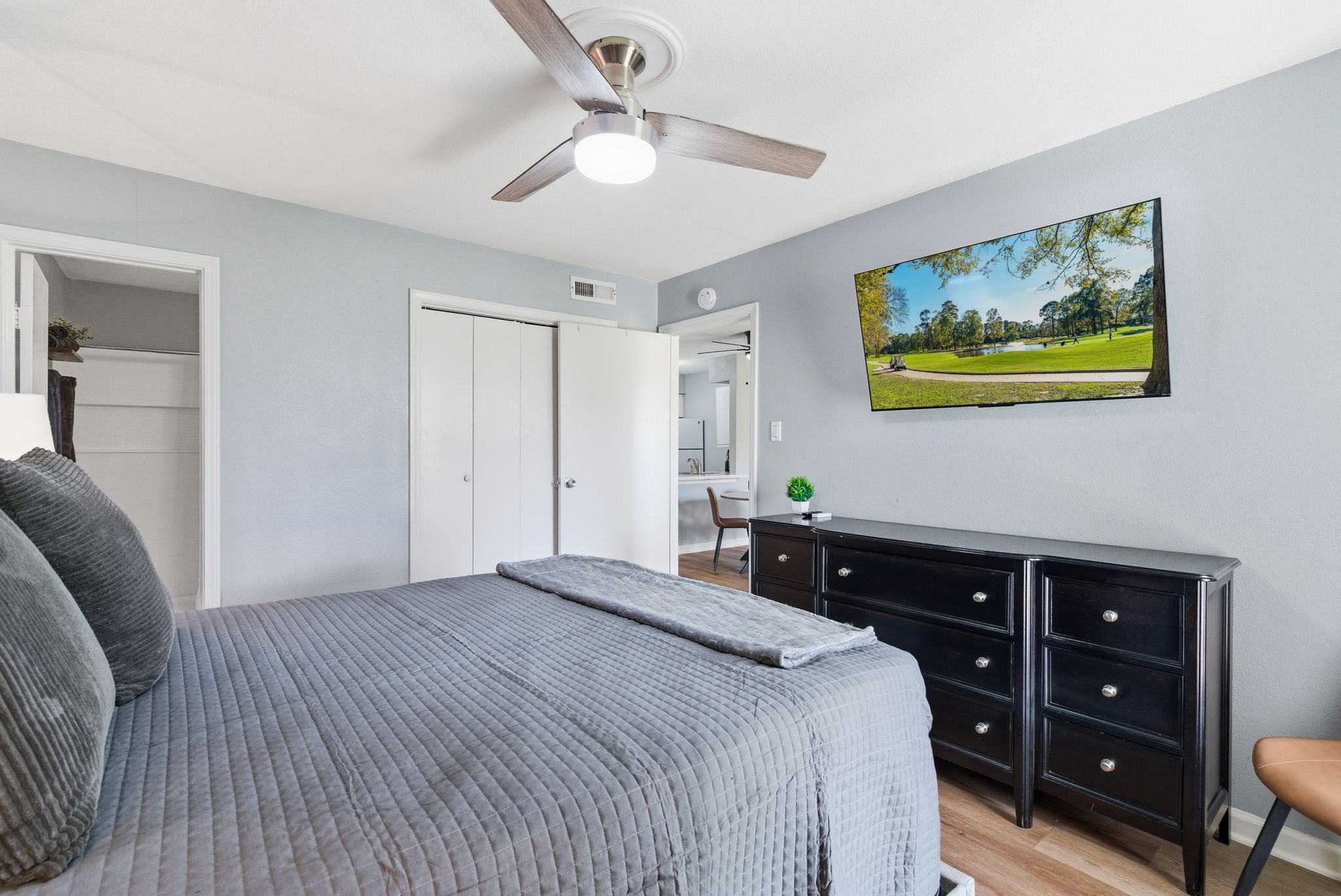 13151 Walden Road, Unit 127 Montgomery, TX 77356 - Photo 15 of 46 a bedroom with a bed and a dresser