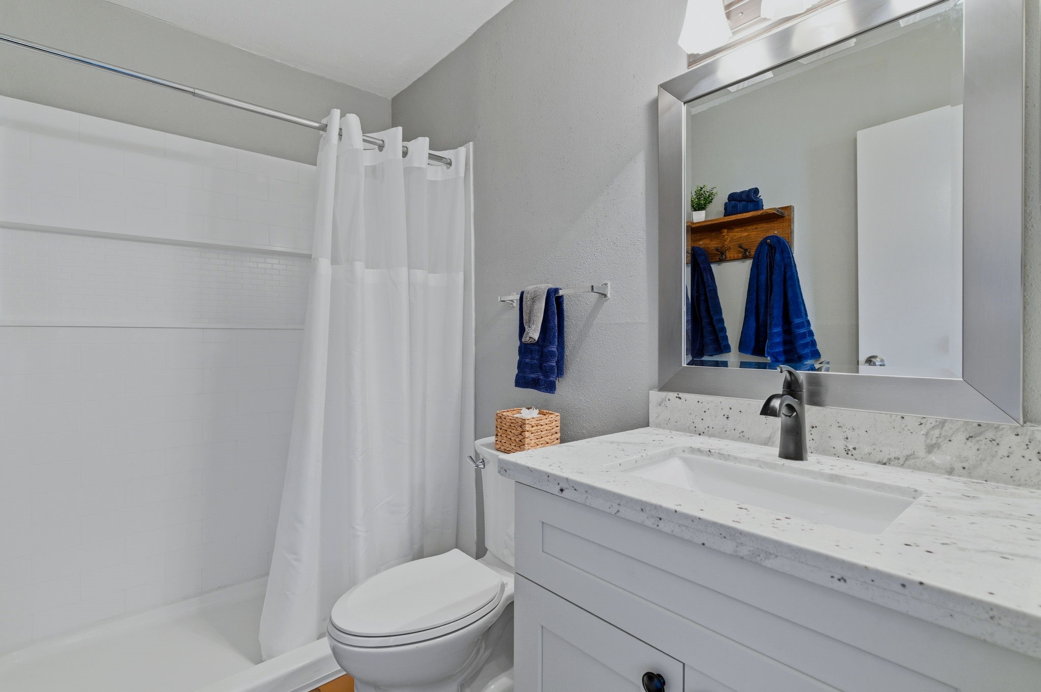 13151 Walden Road, Unit 127 Montgomery, TX 77356 - Photo 16 of 46 a bathroom with a sink a toilet and shower