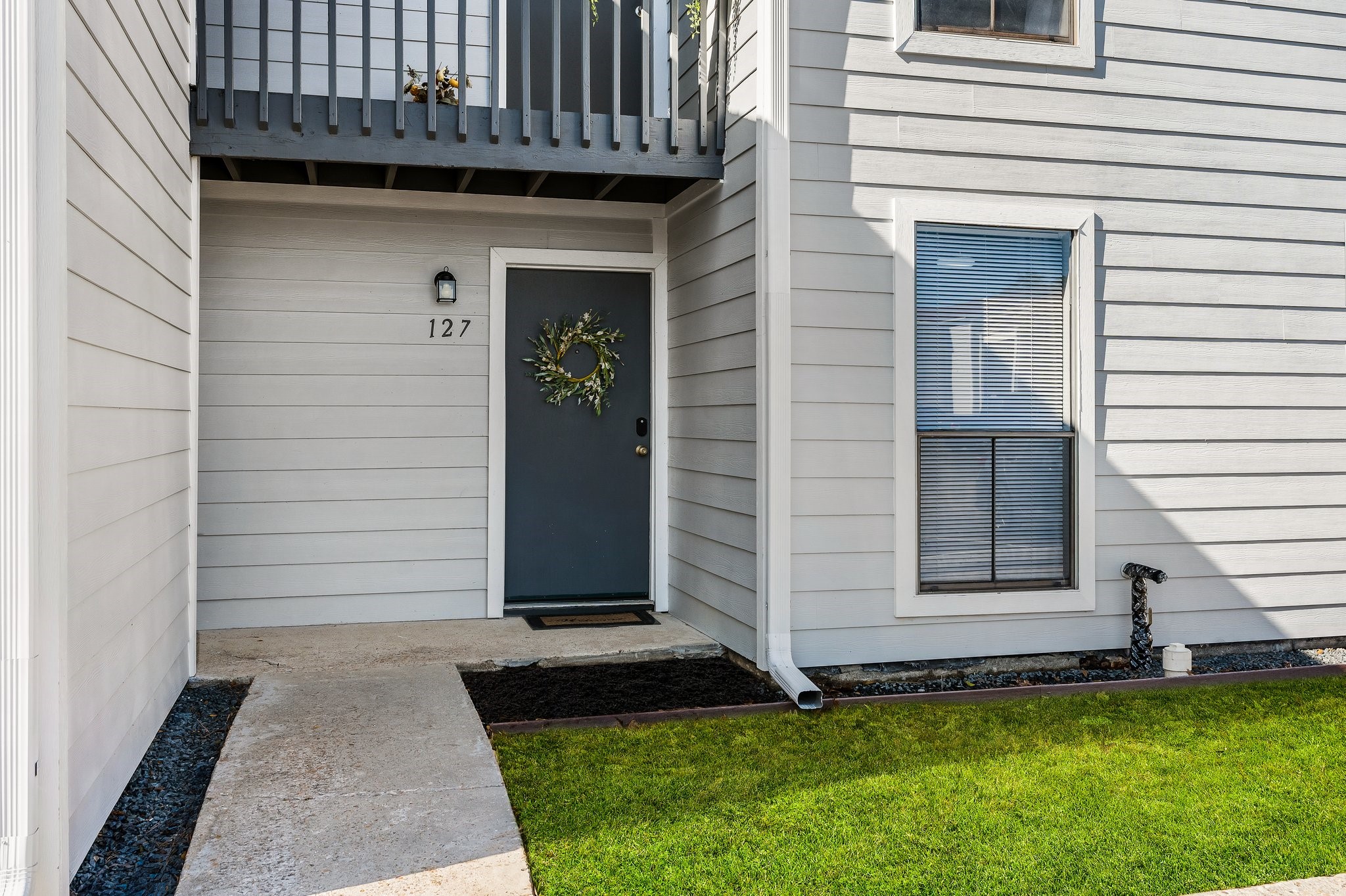 13151 Walden Road, Unit 127 Montgomery, TX 77356 - Photo 21 of 46 a front view of a house with a yard
