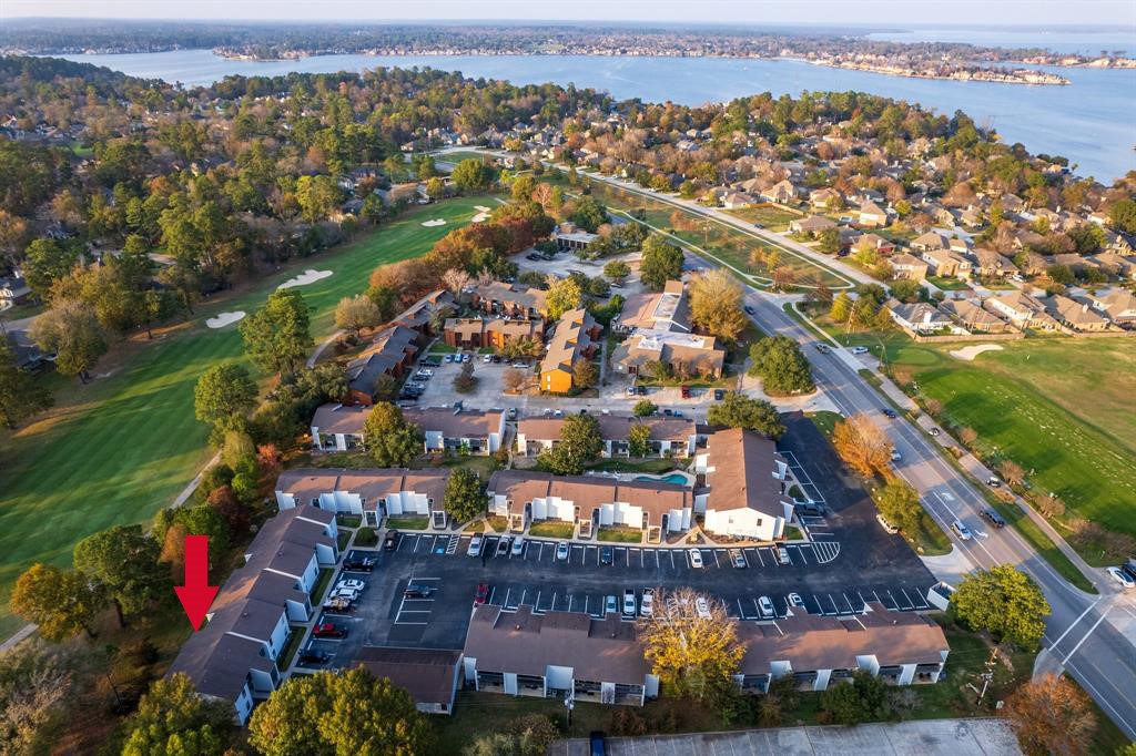 13151 Walden Road, Unit 127 Montgomery, TX 77356 - Photo 24 of 46 an aerial view of residential houses with outdoor space