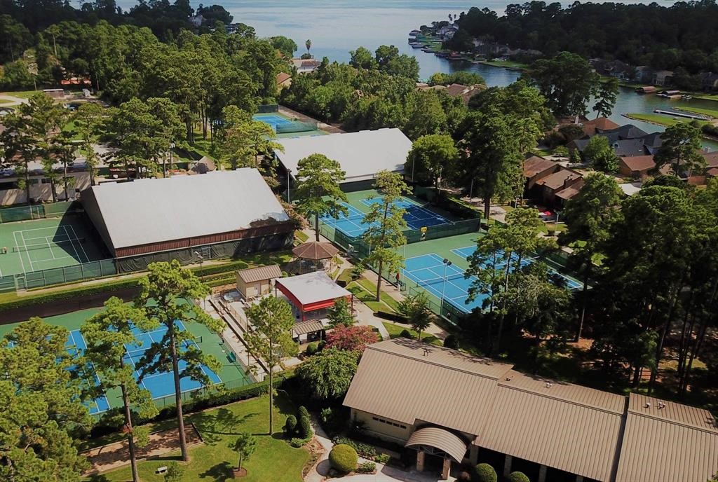 13151 Walden Road, Unit 127 Montgomery, TX 77356 - Photo 35 of 46 an aerial view of a house with garden space and street view