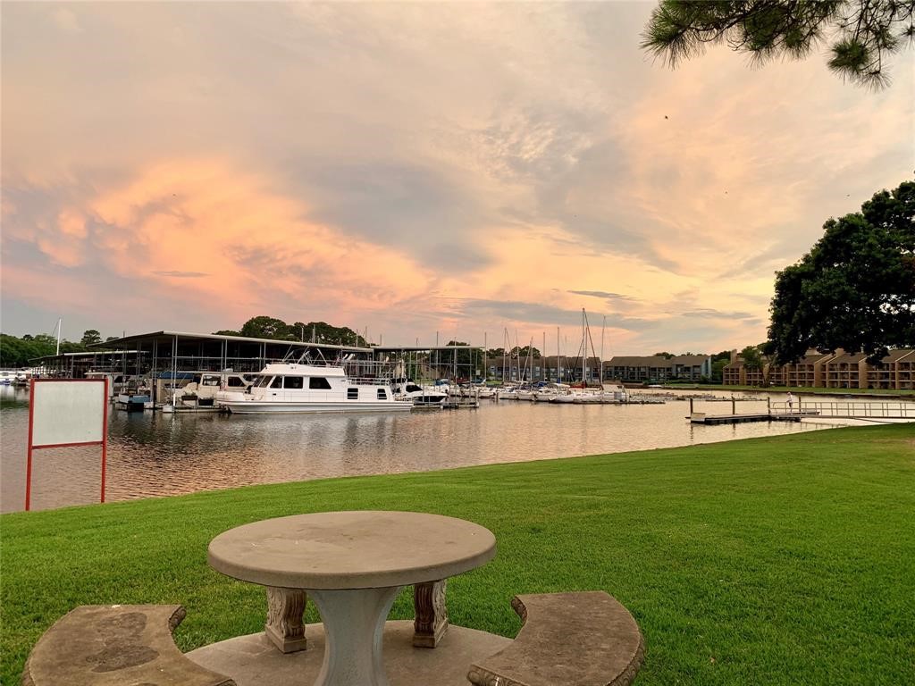 13151 Walden Road, Unit 127 Montgomery, TX 77356 - Photo 44 of 46 a view of a lake with a garden and lake view