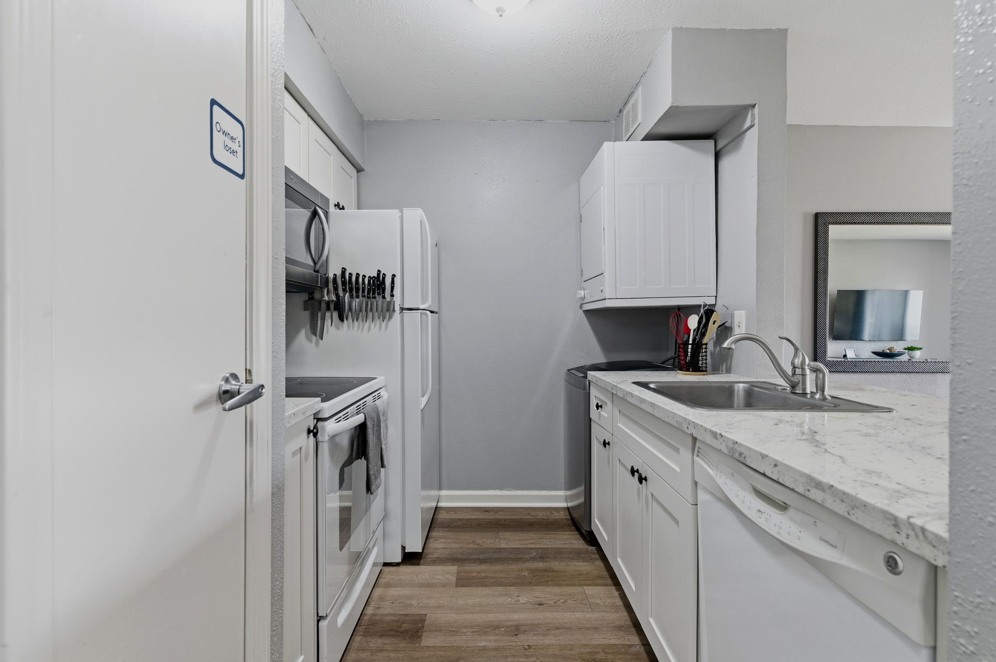 13151 Walden Road, Unit 127 Montgomery, TX 77356 - Photo 8 of 46 a bathroom with a double vanity sink and mirror