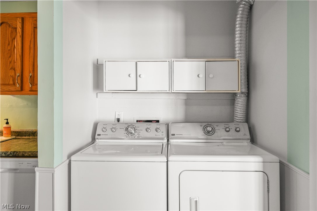 3796 North Santom Road Stow, OH 44224 - Photo 9 of 30 Dedicated laundry area with white appliances, overhead white cabinetry, and a utility shelf