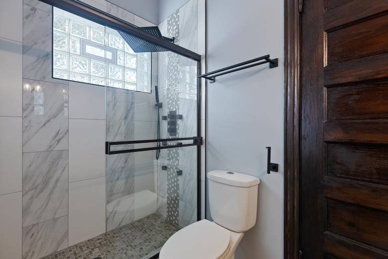 444 East 48th Street, Unit 2W Chicago, IL 60615 - Photo 28 of 31 a white toilet sitting next to a bathroom sink