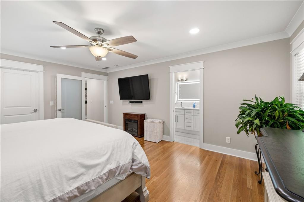 6470 Samoa Way Flowery Branch, GA 30542 - Photo 37 of 61 a bedroom with a bed and a television