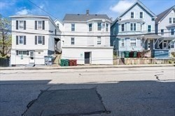716 Lawrence Street, Unit 2 Lowell, MA 01852 - Photo 5 of 9 a view of a building and a street