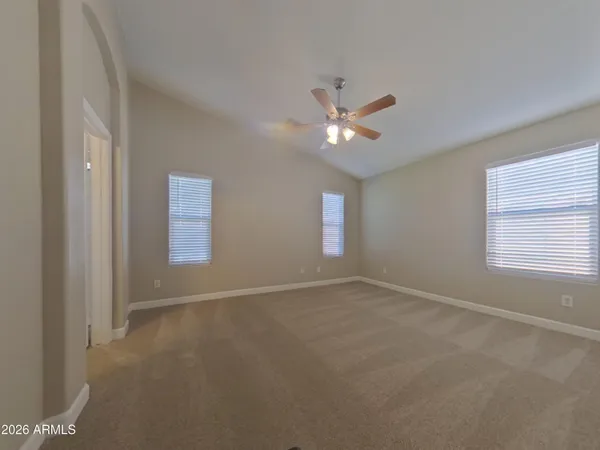 a kitchen with a stove a sink and a microwave