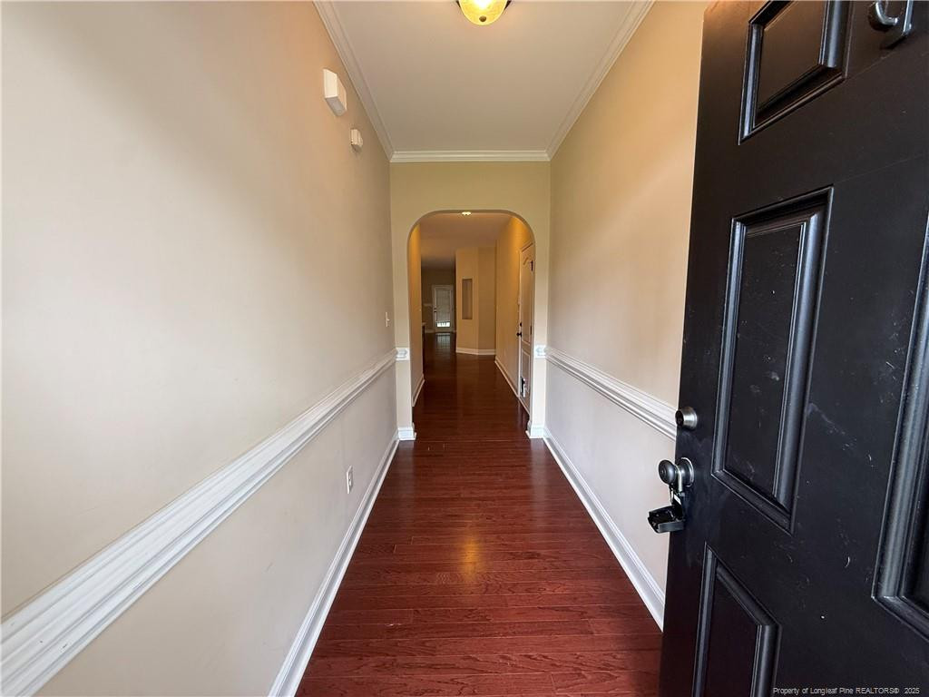 a view of a hallway view with wooden floor and staircase