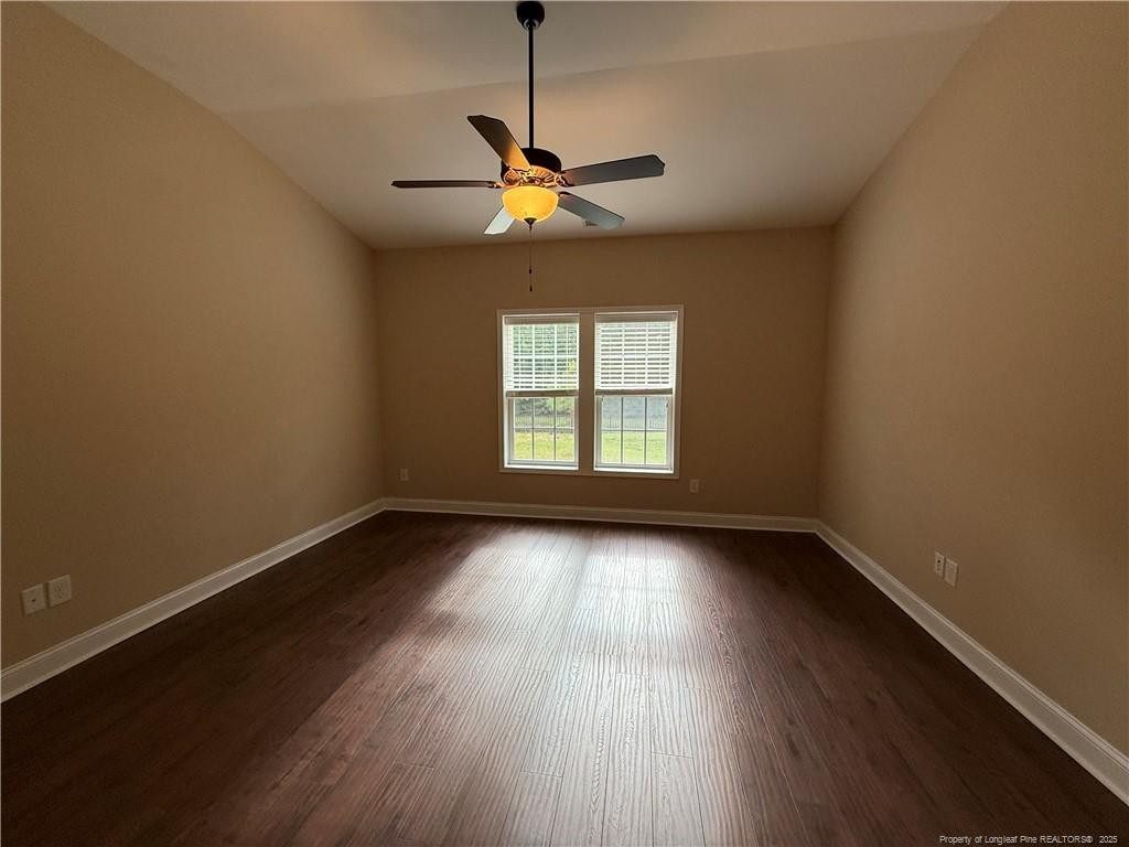 Undisclosed Address Spring Lake, NC 28390 - Photo 14 of 21 a view of an empty room with wooden floor and a window