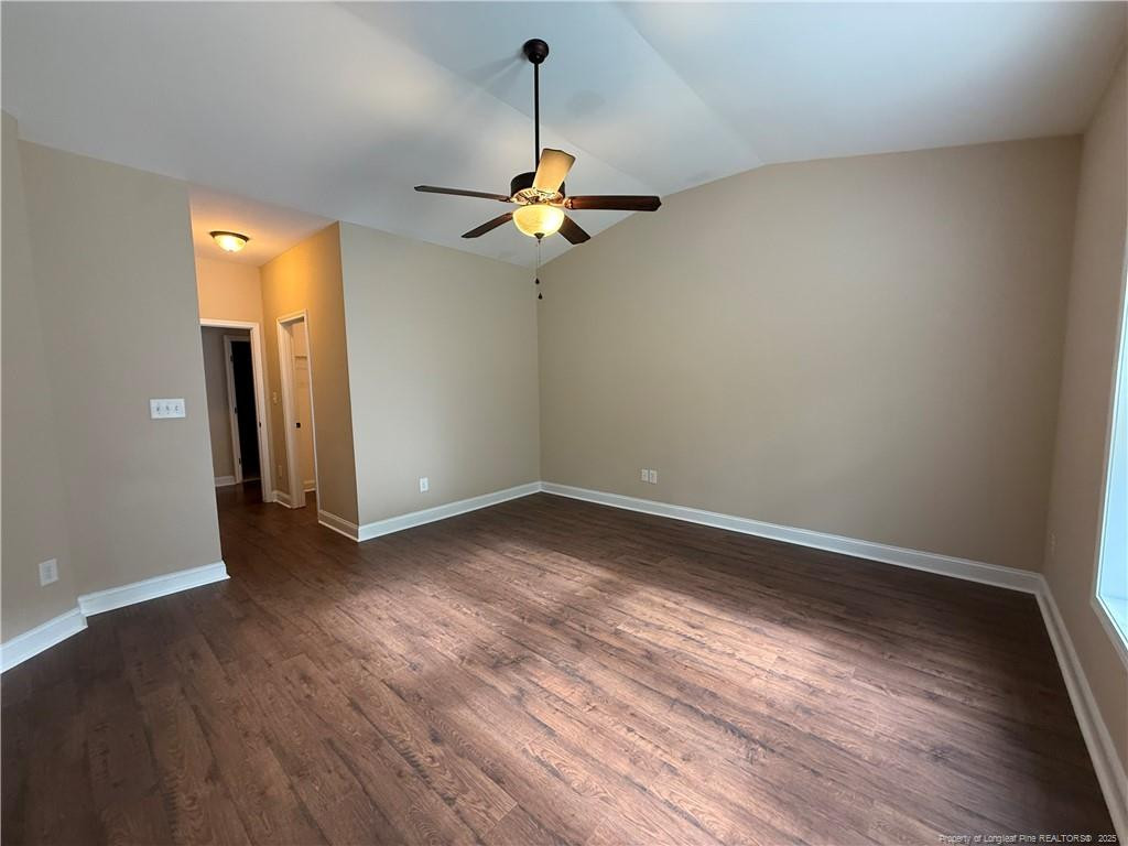 Undisclosed Address Spring Lake, NC 28390 - Photo 15 of 21 wooden floor in an empty room with a window