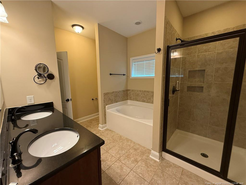 Undisclosed Address Spring Lake, NC 28390 - Photo 17 of 21 a bathroom with a sink toilet and shower