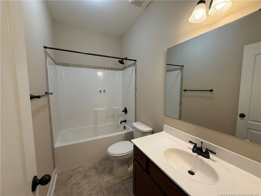 Undisclosed Address Spring Lake, NC 28390 - Photo 9 of 21 a bathroom with a sink a toilet and shower