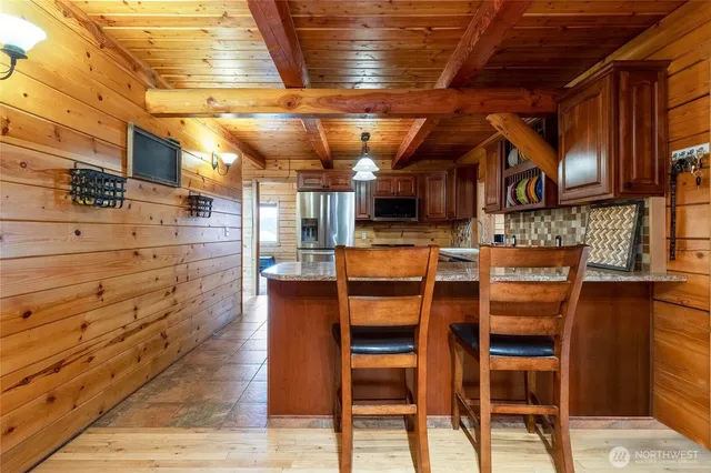 a view of a chairs room with wooden floor