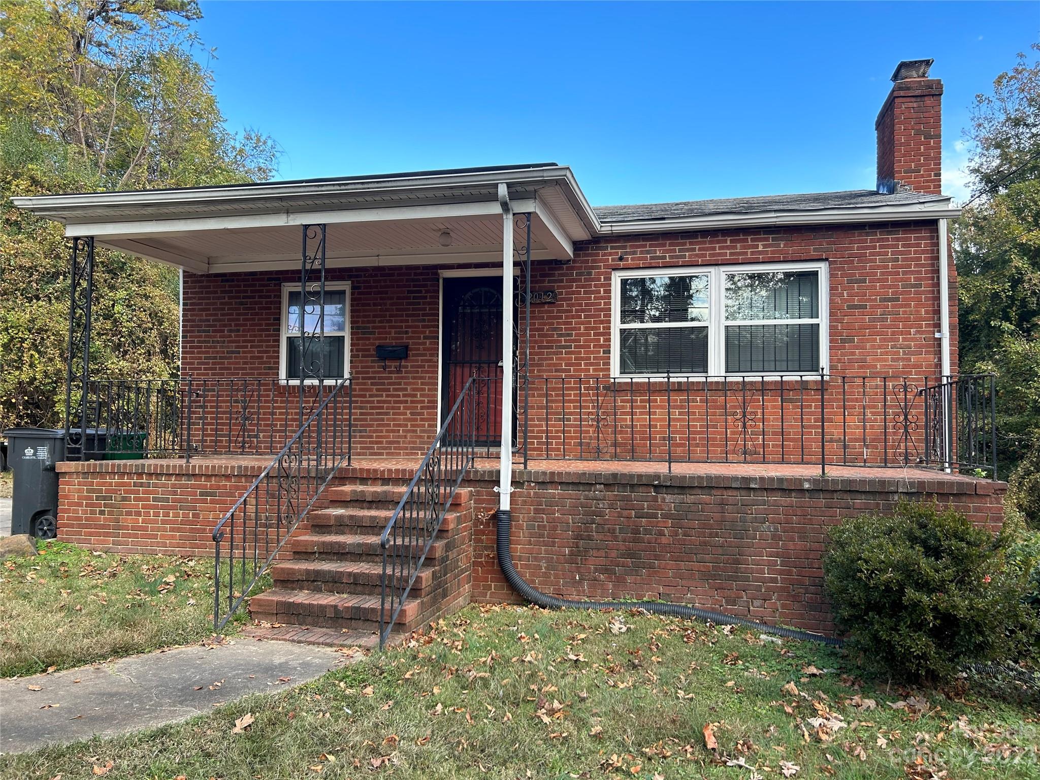 2012 Gilbert Street Charlotte, NC 28216 - Photo 1 of 13 front view of a house with a yard