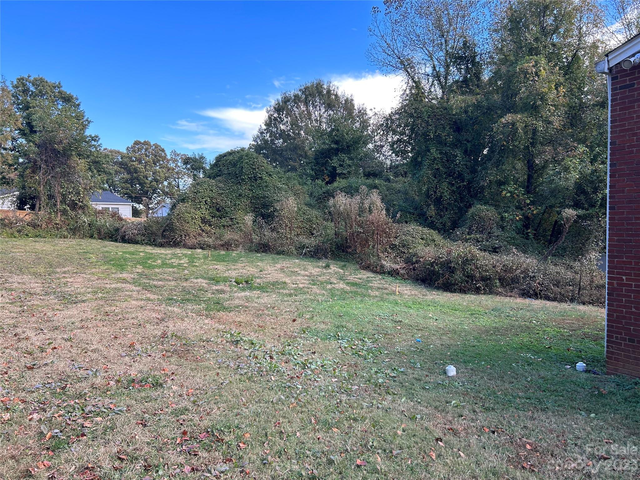 2012 Gilbert Street Charlotte, NC 28216 - Photo 11 of 13 a view of a field with trees in the background