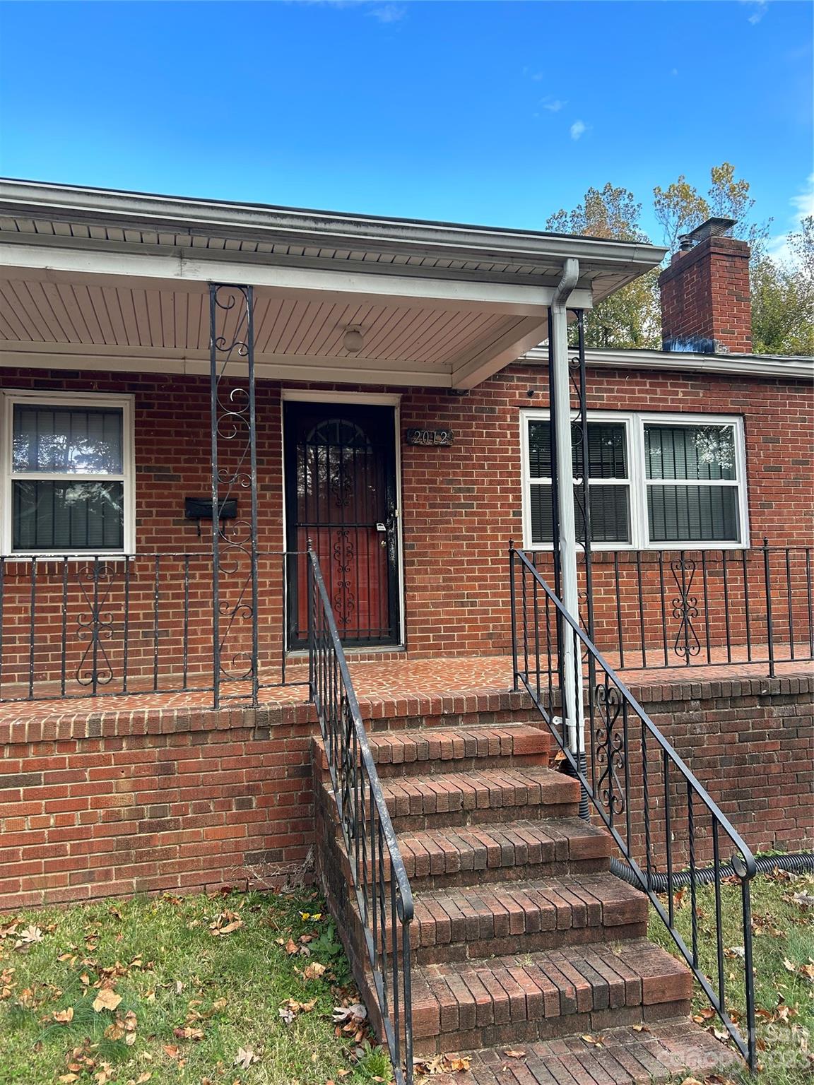 2012 Gilbert Street Charlotte, NC 28216 - Photo 2 of 13 a view of a house with wooden fence