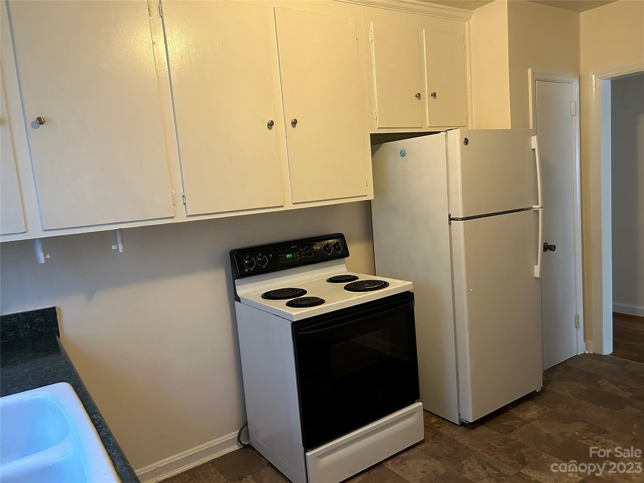 2012 Gilbert Street Charlotte, NC 28216 - Photo 6 of 13 a kitchen with a refrigerator and a stove