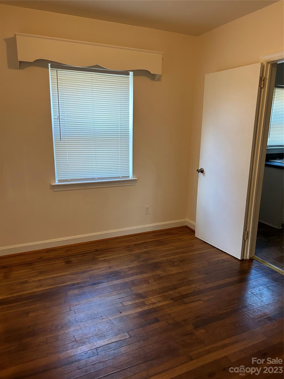 2012 Gilbert Street Charlotte, NC 28216 - Photo 10 of 13 a view of a small space with wooden floor and a window