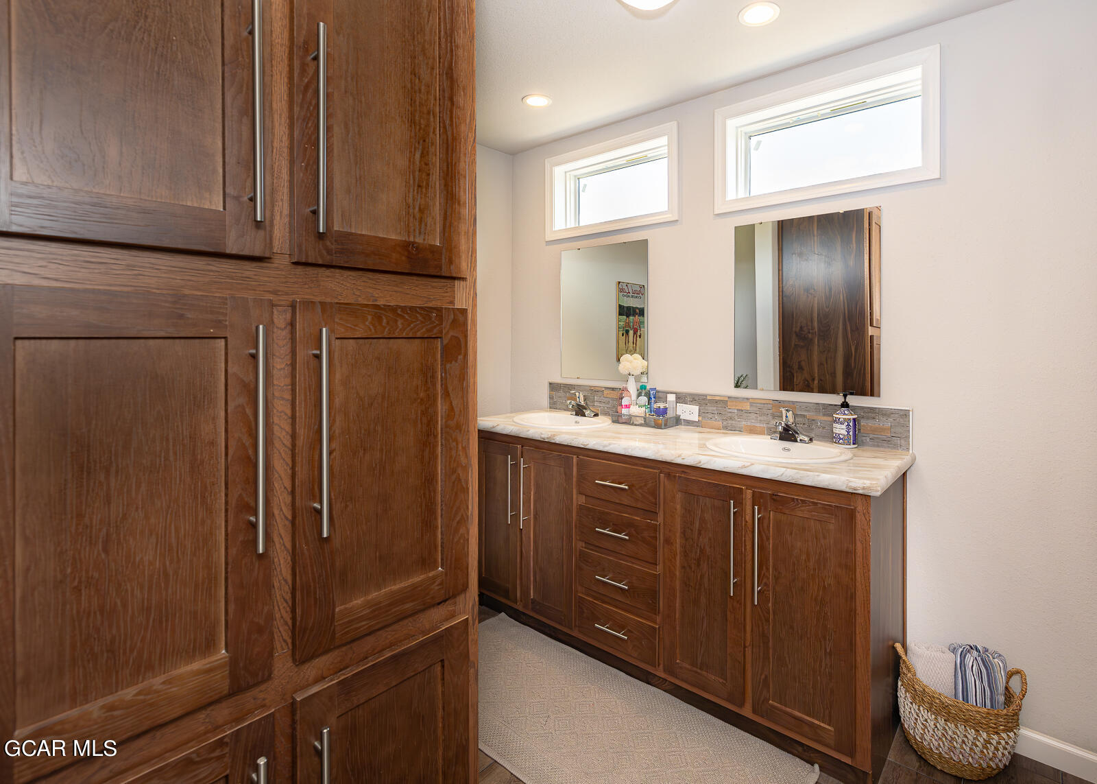 551 Summit Trail, Unit 34 Granby, CO 80446 - Photo 12 of 35 a bathroom with a sink vanity and mirror