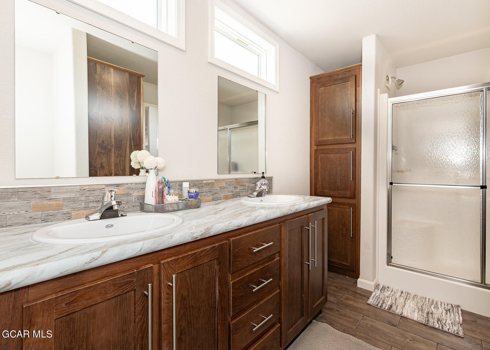 551 Summit Trail, Unit 34 Granby, CO 80446 - Photo 13 of 35 a bathroom with a granite countertop sink and a mirror