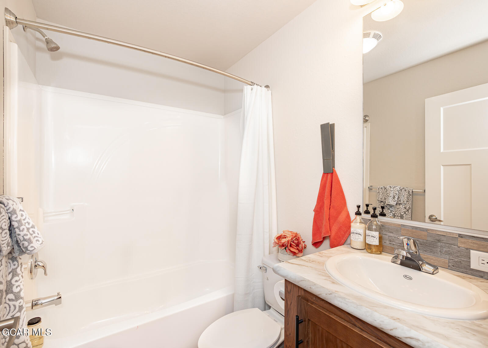 551 Summit Trail, Unit 34 Granby, CO 80446 - Photo 16 of 35 a bathroom with a sink vanity and a tub