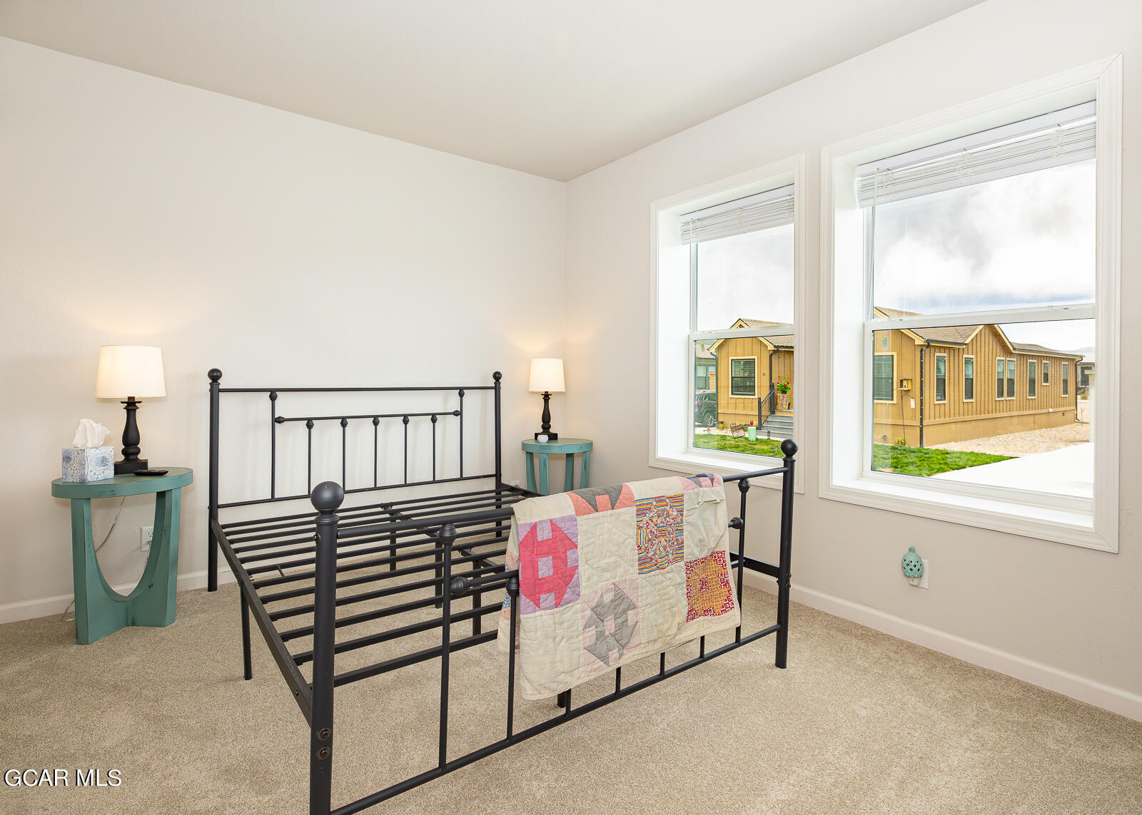 551 Summit Trail, Unit 34 Granby, CO 80446 - Photo 17 of 35 a bedroom with furniture and a window