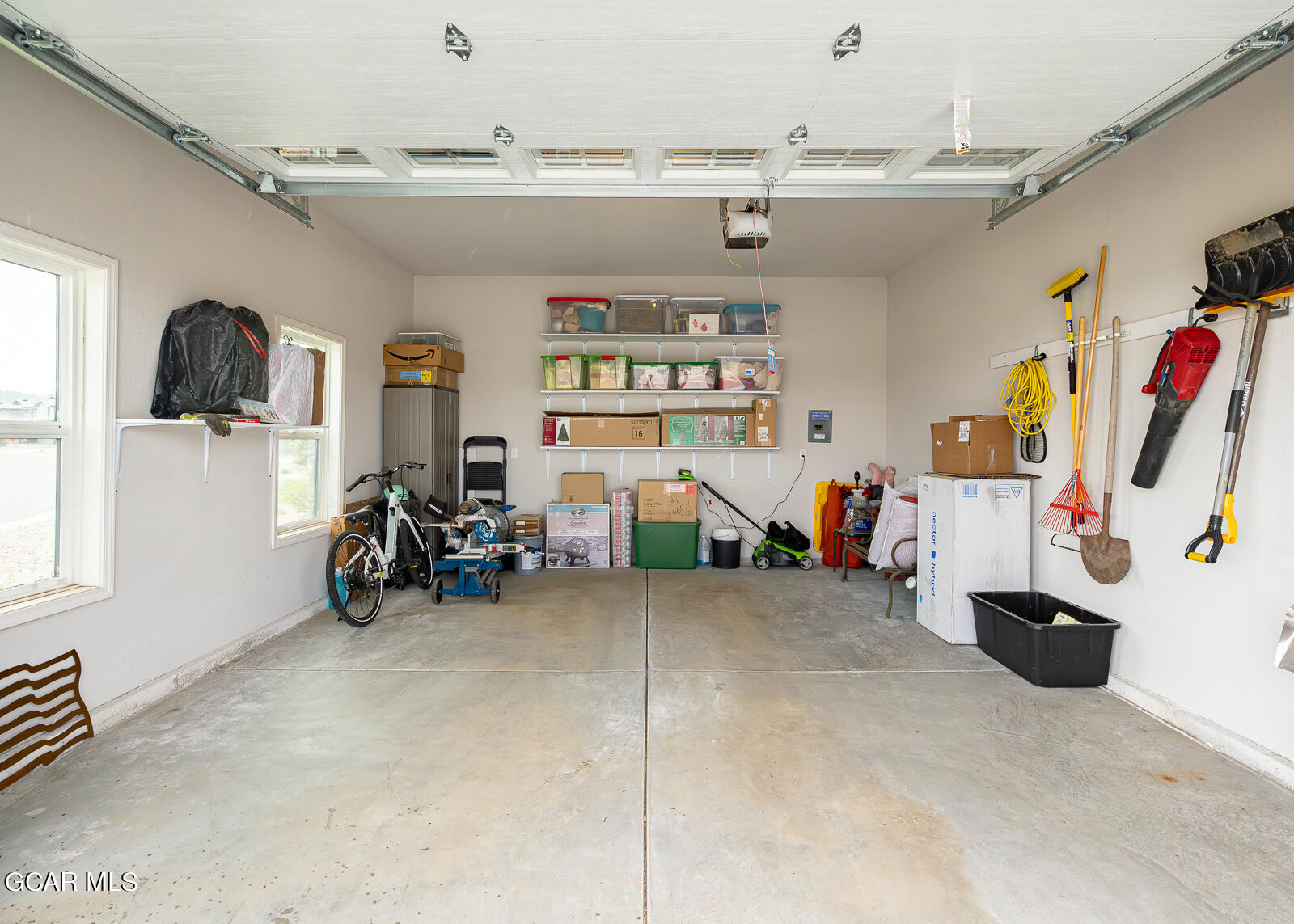 551 Summit Trail, Unit 34 Granby, CO 80446 - Photo 20 of 35 a view of a garage with furniture and a large window