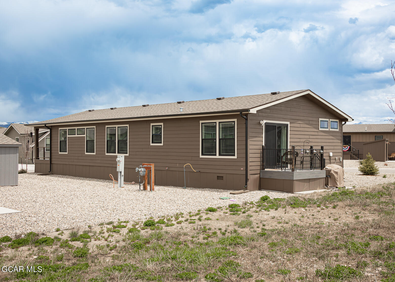 551 Summit Trail, Unit 34 Granby, CO 80446 - Photo 27 of 35 a front view of a house with a yard