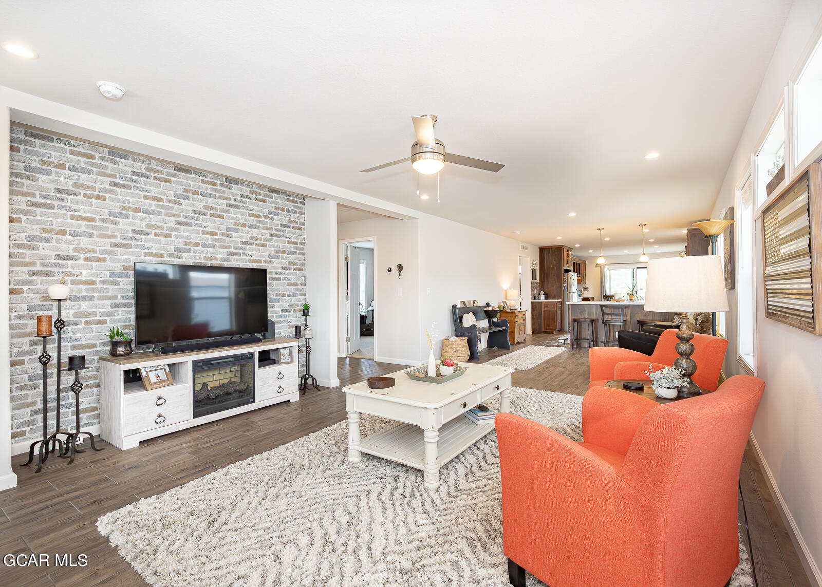 551 Summit Trail, Unit 34 Granby, CO 80446 - Photo 3 of 35 a living room with furniture and a flat screen tv
