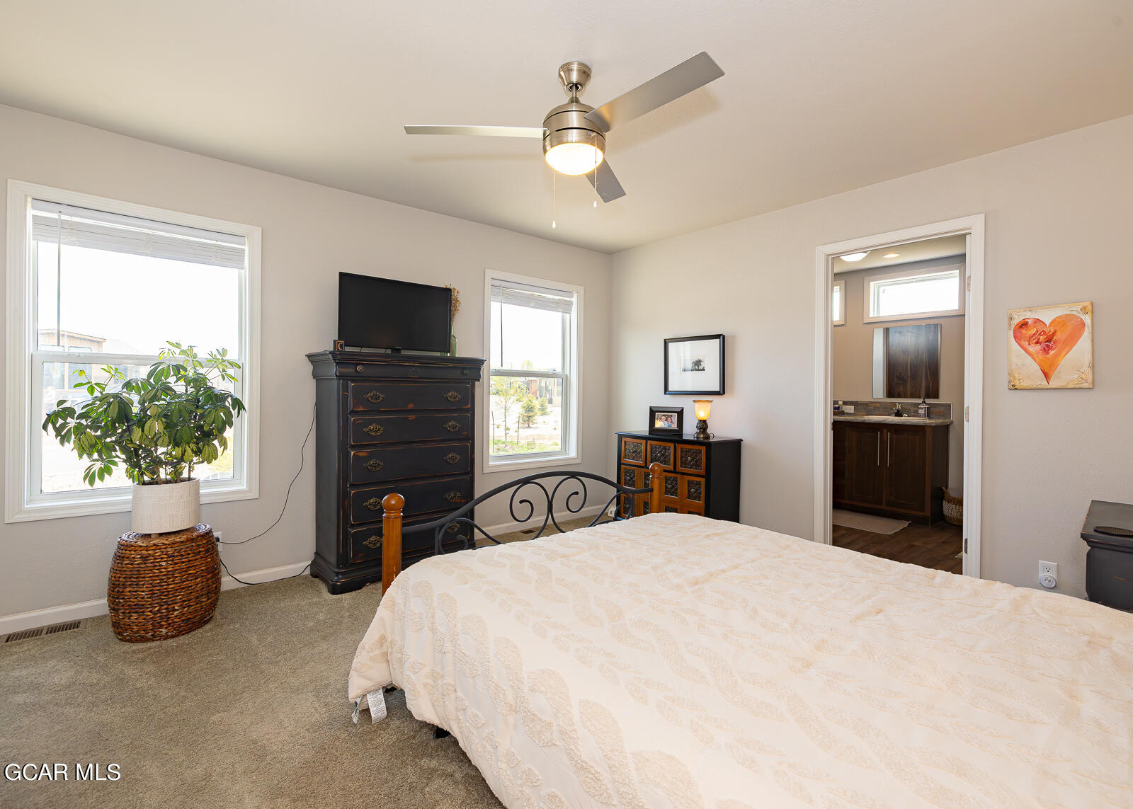 551 Summit Trail, Unit 34 Granby, CO 80446 - Photo 9 of 35 a bedroom with a bed and a television