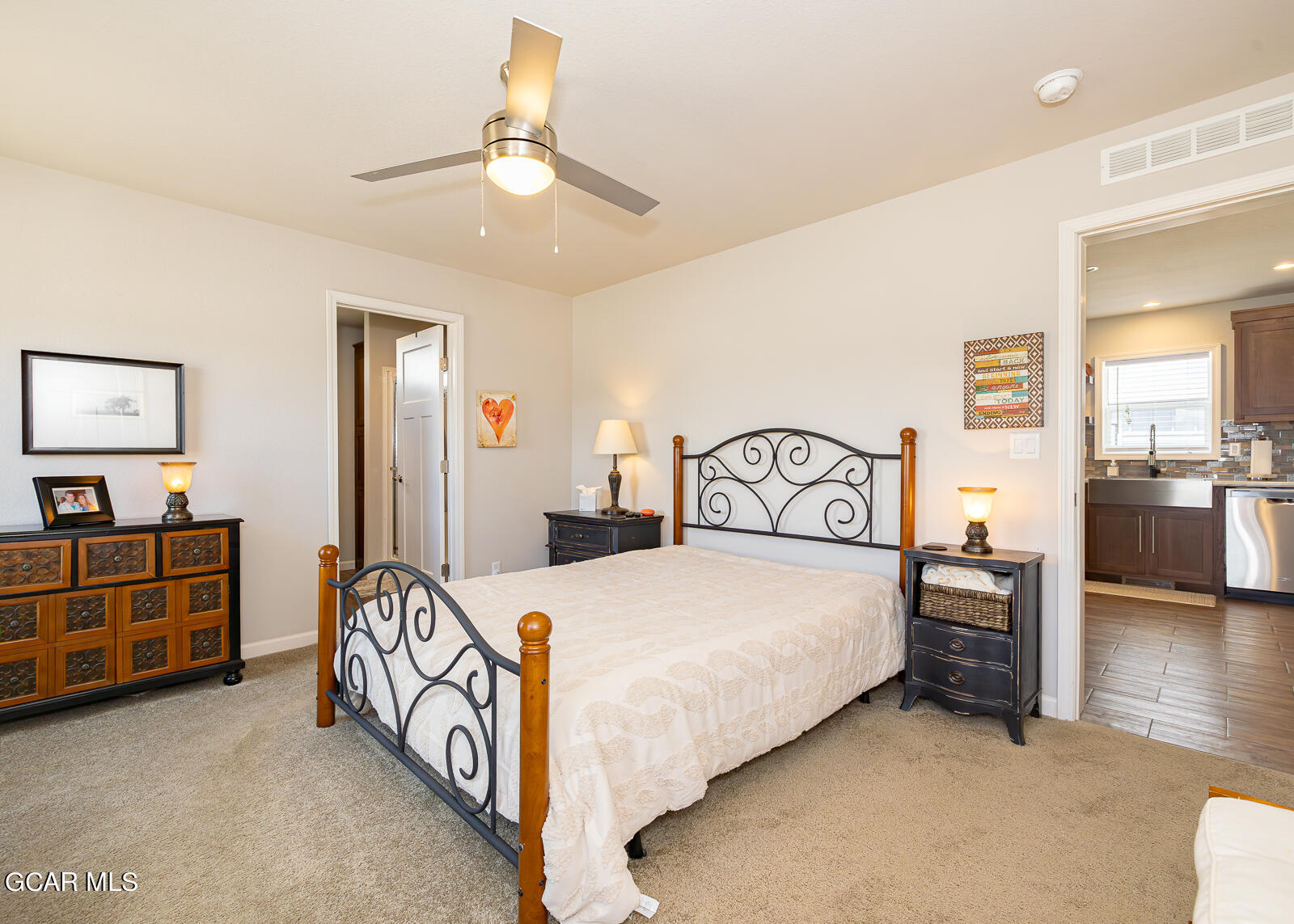 551 Summit Trail, Unit 34 Granby, CO 80446 - Photo 10 of 35 a bedroom with a bed and a chandelier