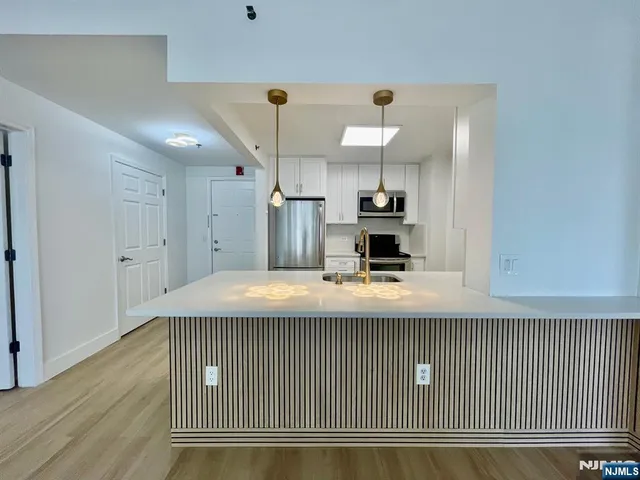 a view of a kitchen with a sink