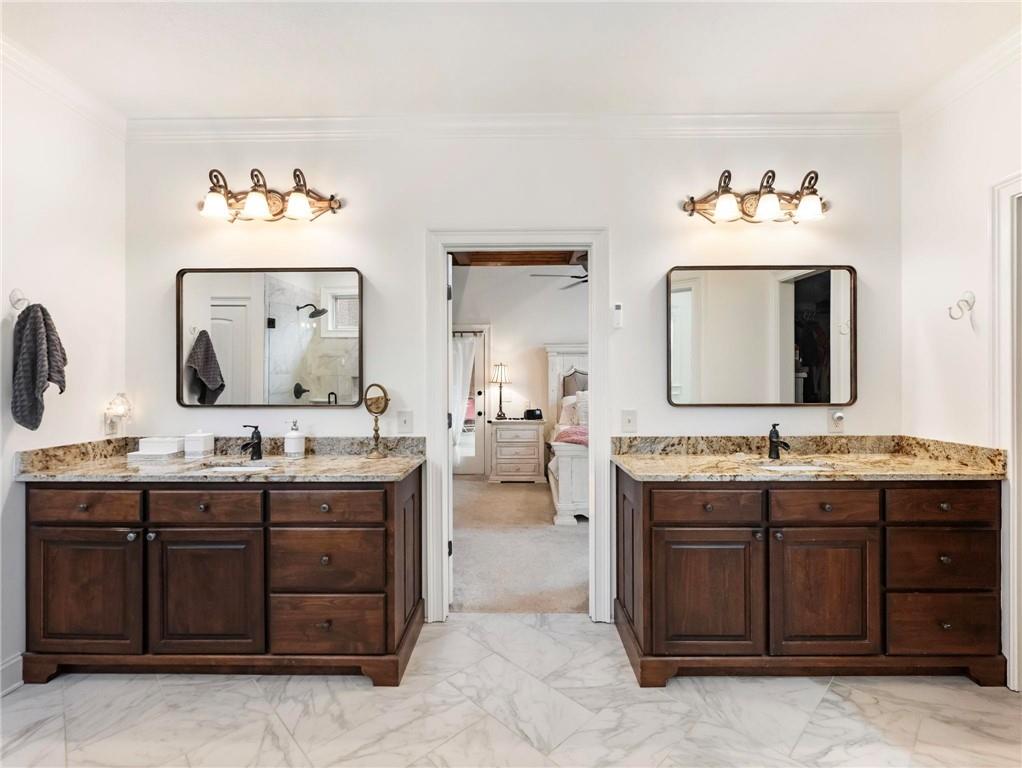 8629 Drake Drive Lula, GA 30554 - Photo 22 of 78 a bathroom with a granite countertop double vanity sink and a mirror
